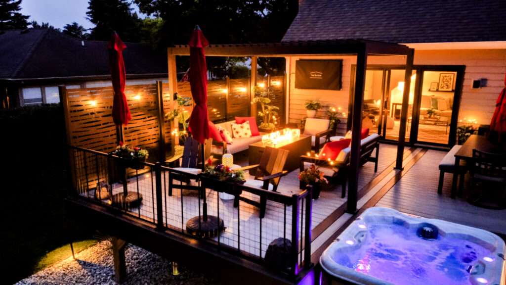 Outdoor deck lighting and seating area built by Decked Out Builders
