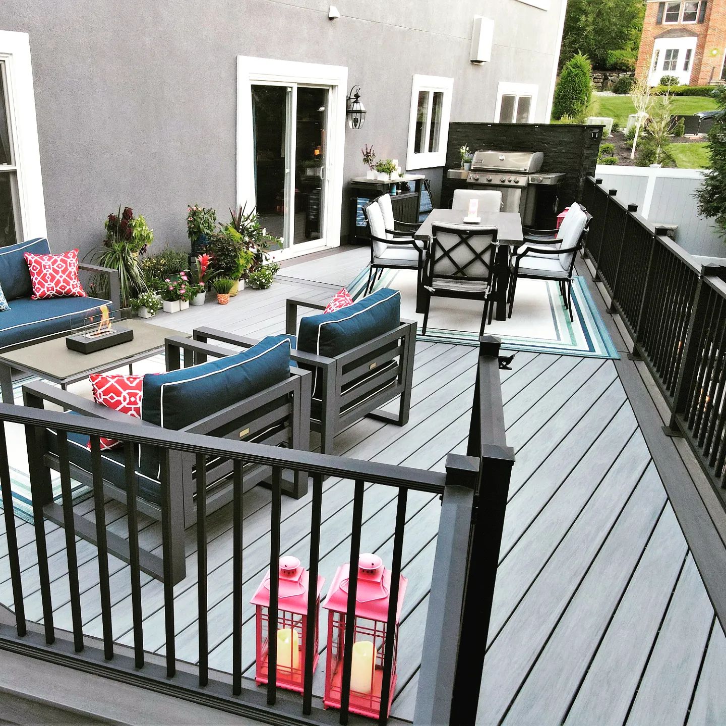 Composite deck with modern railing by Decked Out Builders in Crystal Lake, IL